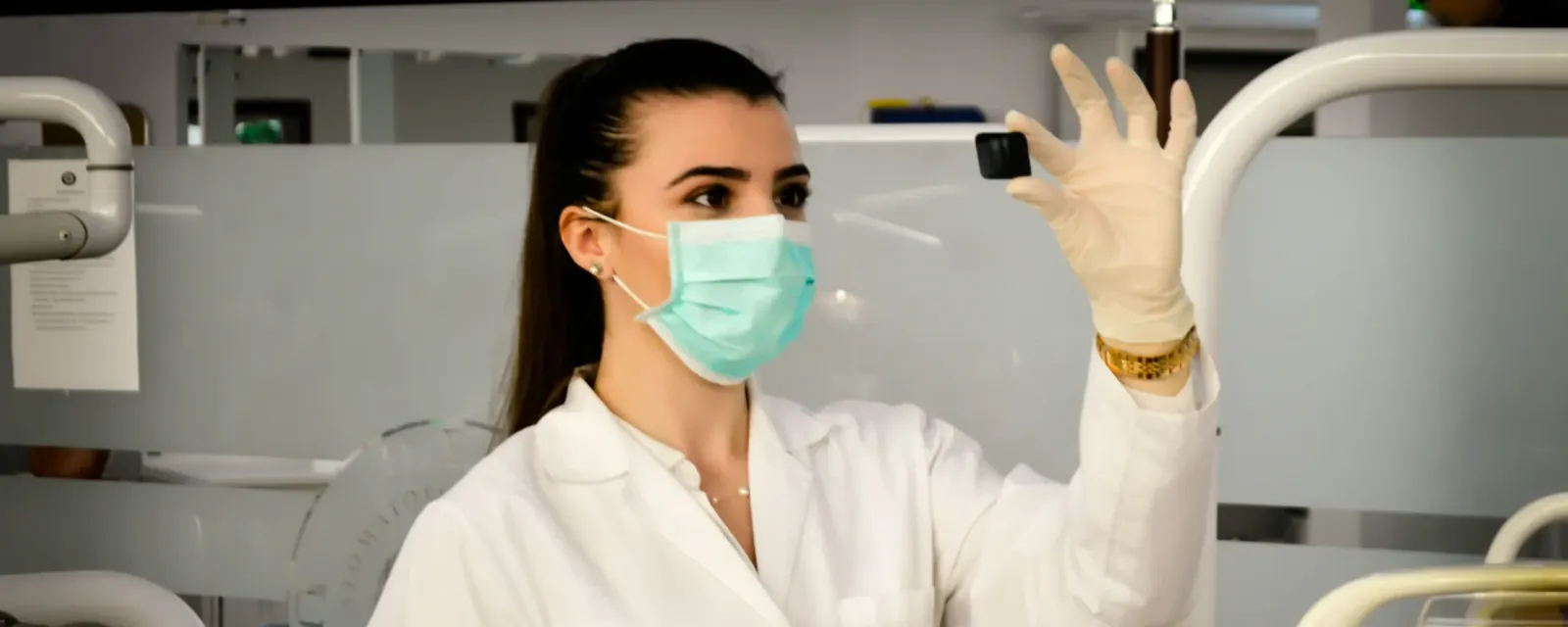 A radiographer positioning a patient scanner in an imaging suite